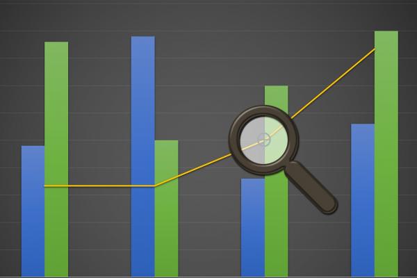 Magnifying glass over bar chart