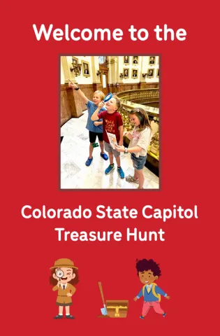 Kids exploring the capitol building interior with magnifying glasses
